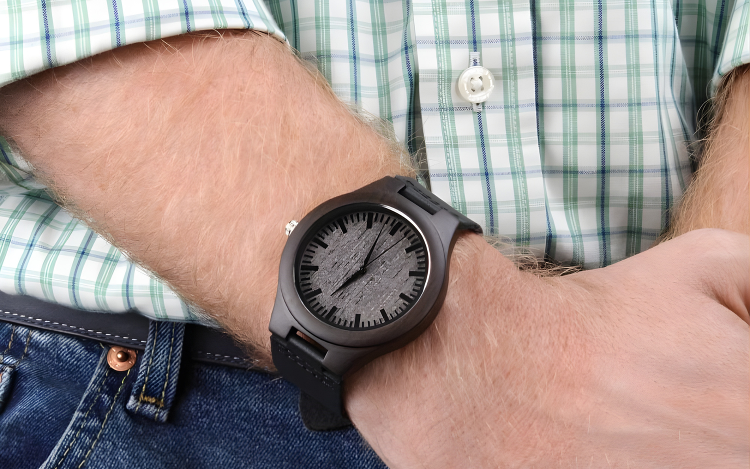 Close-up of the Lumen & Oak Sandalwood Legacy wooden watch on a man's wrist, highlighting the lightweight sustainable sandalwood case and breathable black leather strap.
